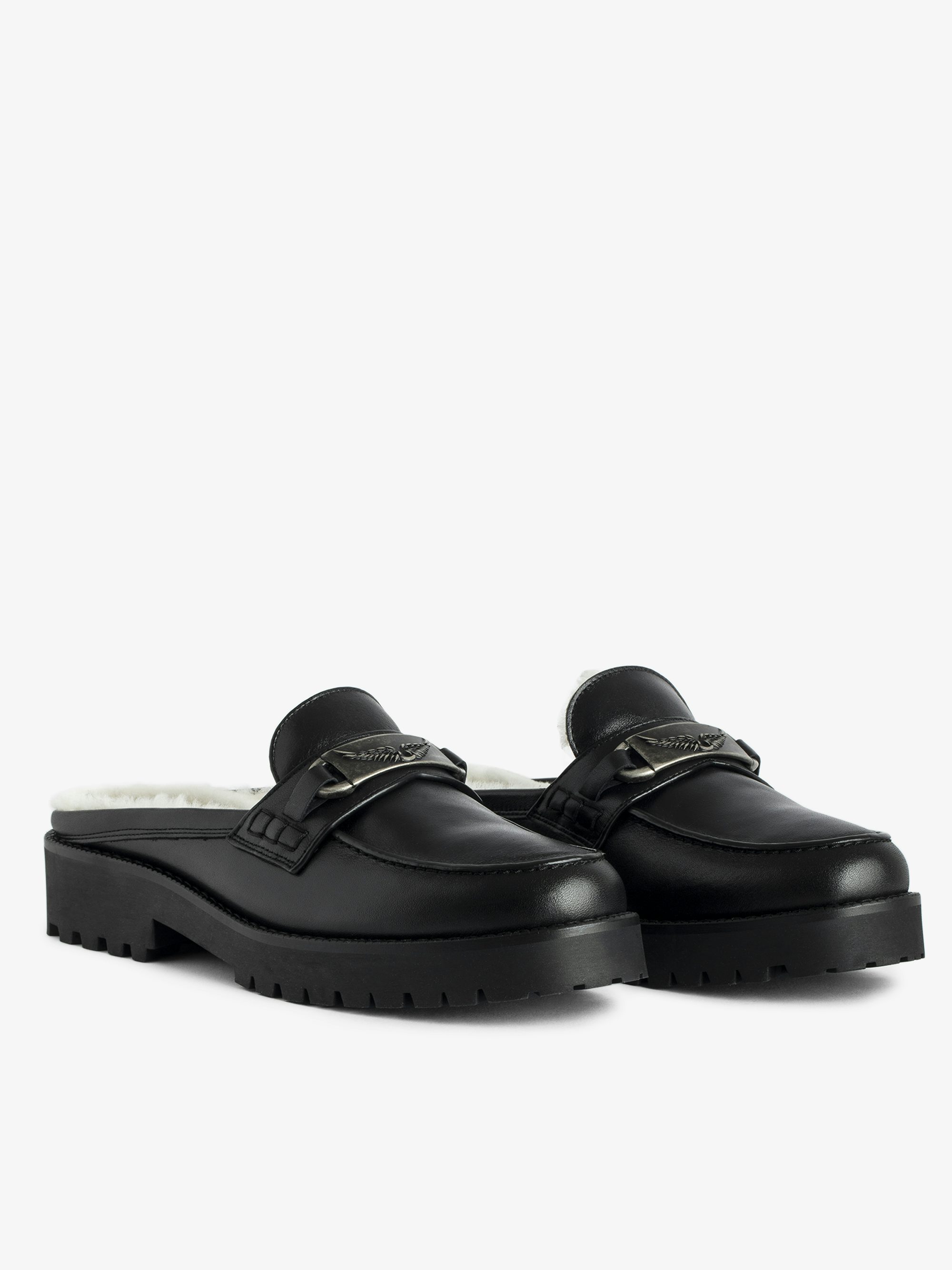 Joecassin Mules - Gefütterte Mules aus glattem Leder, verziert mit einem Flügel-Charm.